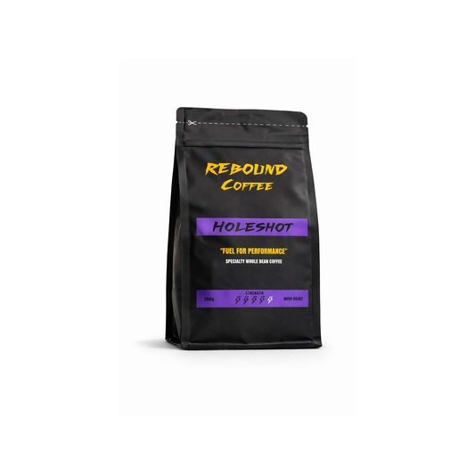 Black coffee bag with 'Rebound Coffee' branding on a white background